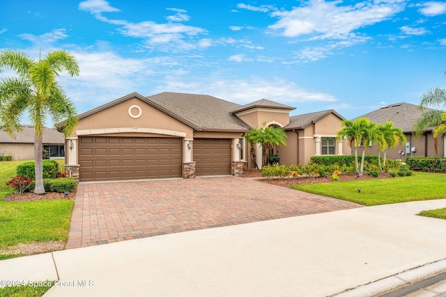 view of front facade with a garage and a front yard