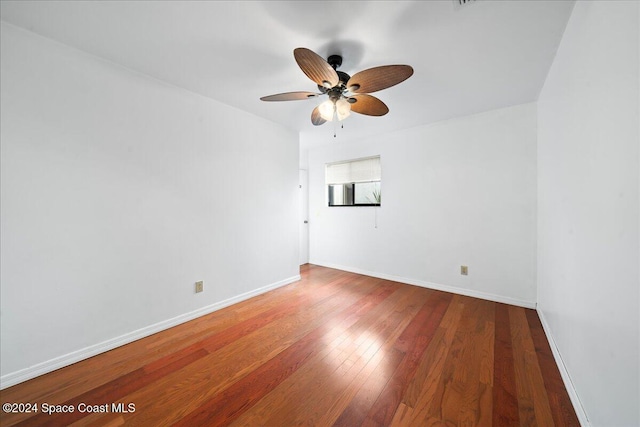 unfurnished room with hardwood / wood-style flooring and ceiling fan