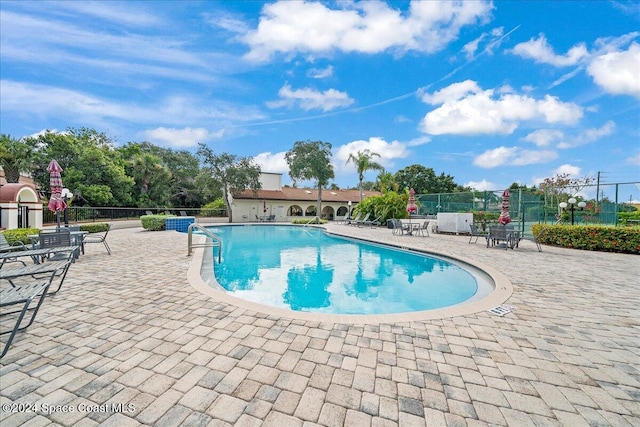 view of swimming pool with a patio area