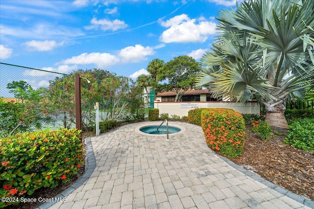 view of patio / terrace featuring a hot tub