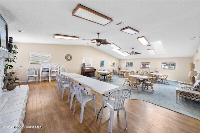 dining space with hardwood / wood-style flooring, plenty of natural light, and ceiling fan