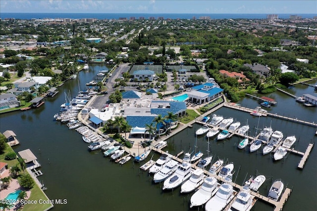 birds eye view of property with a water view