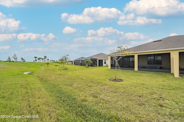 view of yard featuring a sunroom