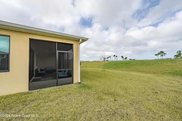 view of yard with a sunroom