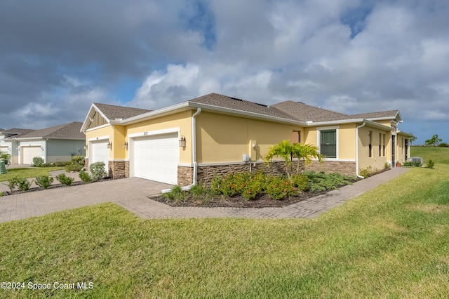 view of home's exterior featuring a lawn and a garage