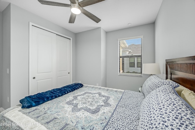 bedroom featuring ceiling fan and a closet