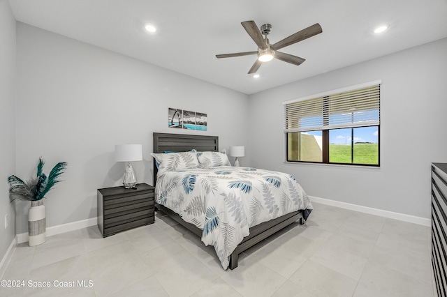 tiled bedroom with ceiling fan