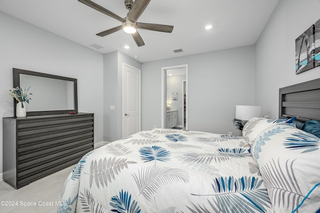 bedroom with ensuite bath and ceiling fan