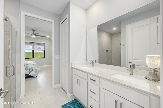 bathroom with tile patterned flooring, an enclosed shower, vanity, and ceiling fan