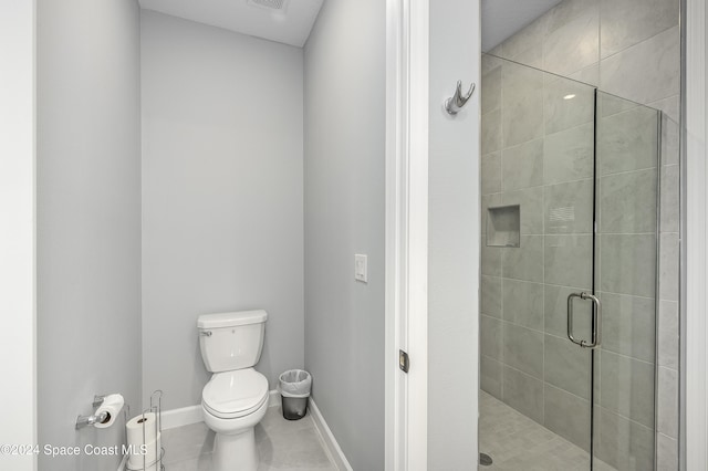 bathroom featuring toilet, tile patterned flooring, and walk in shower