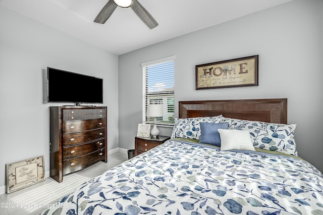 bedroom featuring light tile patterned flooring and ceiling fan