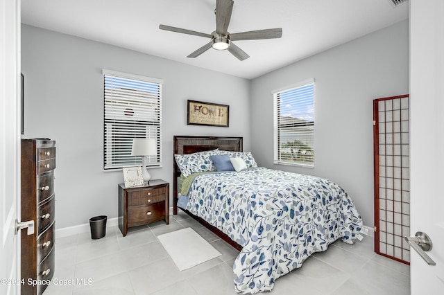 bedroom with light tile patterned flooring and ceiling fan