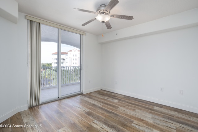 empty room featuring ceiling fan and wood-type flooring