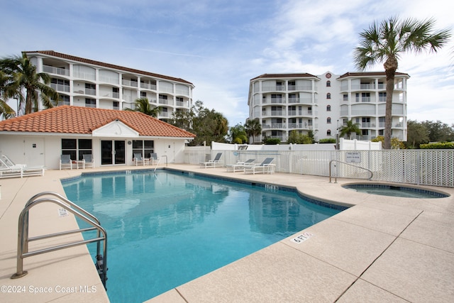 view of swimming pool featuring a patio area