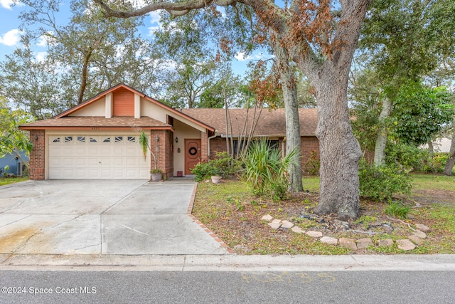 ranch-style house featuring a garage