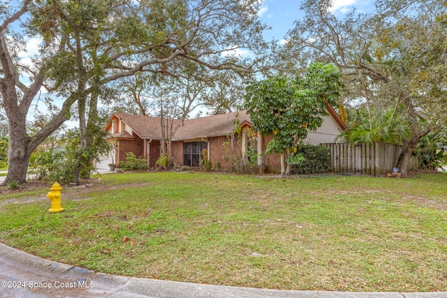 view of front of house featuring a front lawn and a garage