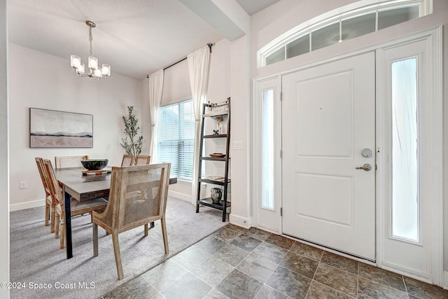 entrance foyer with a chandelier