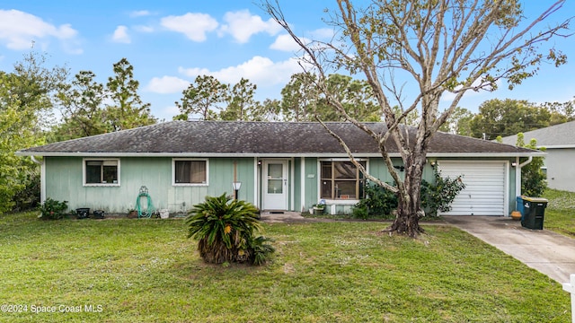 single story home with a front yard and a garage