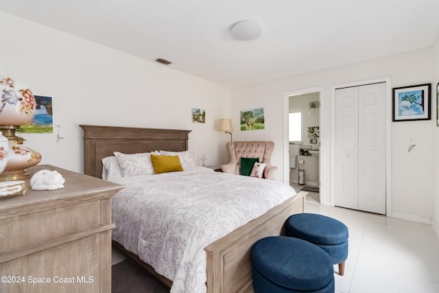 tiled bedroom with a closet