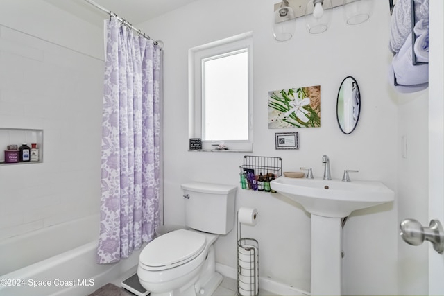 bathroom featuring toilet and shower / bathtub combination with curtain