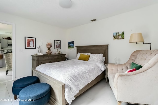 bedroom featuring light tile patterned flooring