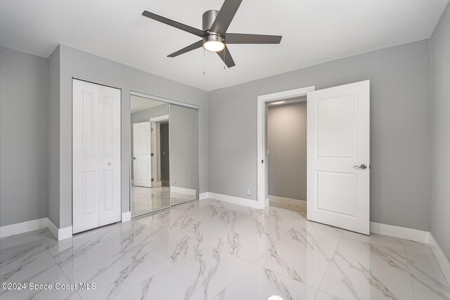 unfurnished bedroom featuring ceiling fan