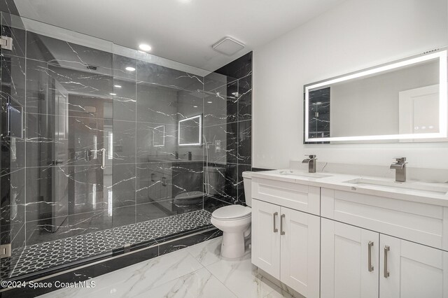 bathroom with walk in shower, vanity, and toilet