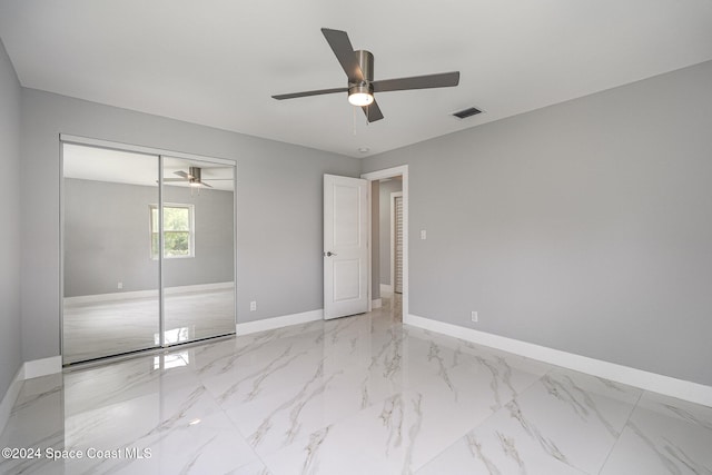 unfurnished bedroom with a closet and ceiling fan