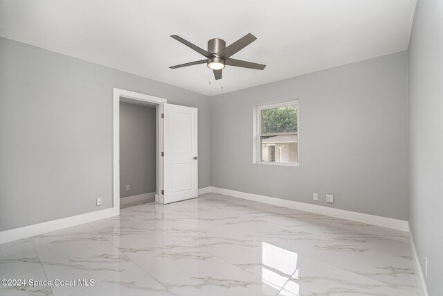 unfurnished room with ceiling fan