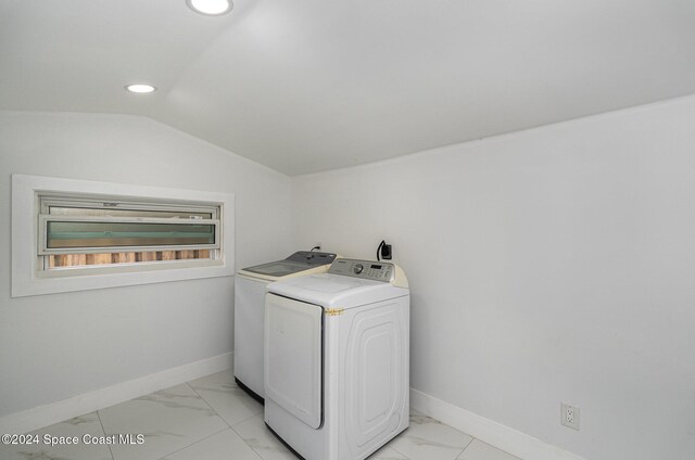 clothes washing area with independent washer and dryer