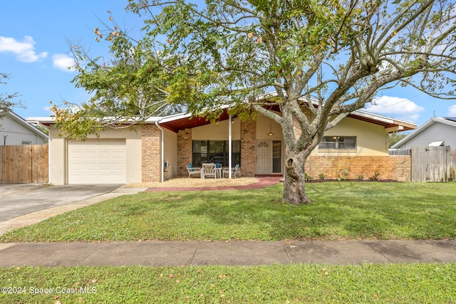 ranch-style house with a front lawn and a garage