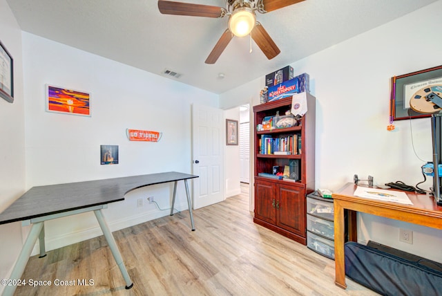 office space with light hardwood / wood-style flooring and ceiling fan