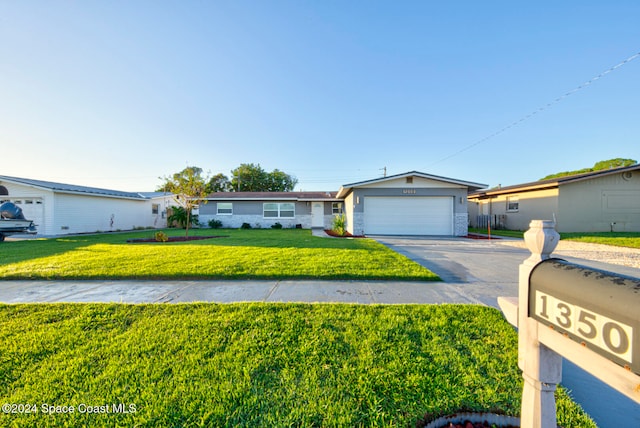 ranch-style home featuring a front yard and a garage