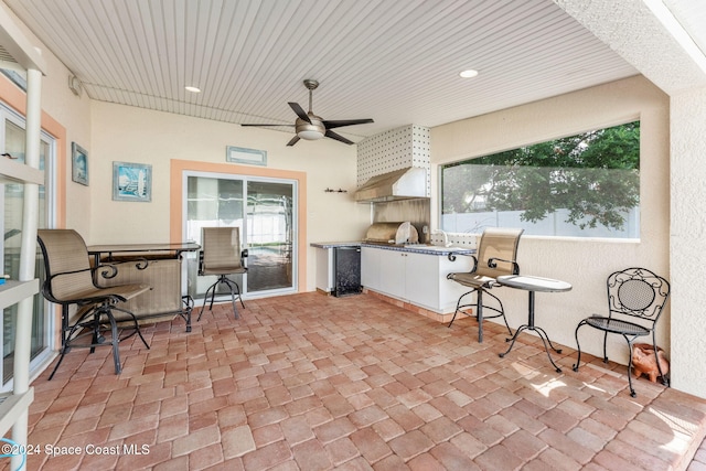 view of patio featuring an outdoor kitchen and ceiling fan