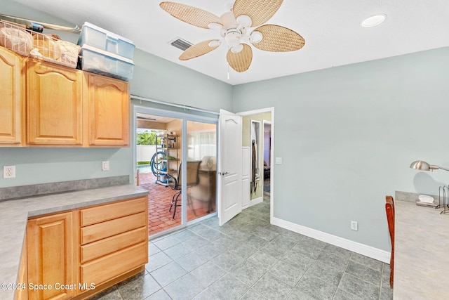 kitchen with light brown cabinetry, light tile patterned flooring, and ceiling fan