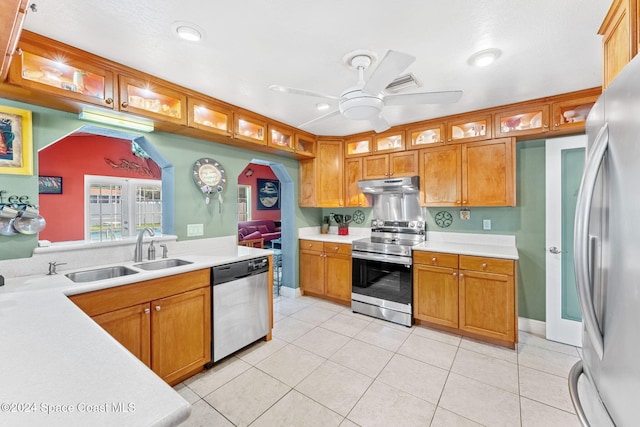 kitchen with ceiling fan, stainless steel appliances, sink, and light tile patterned floors