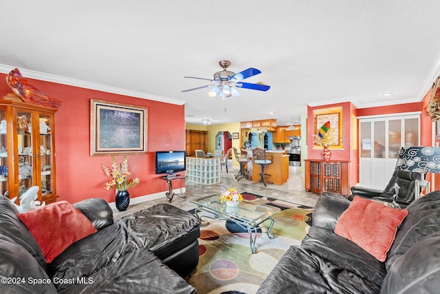 living room with crown molding and ceiling fan