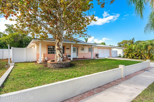 view of front of home featuring a garage and a front yard