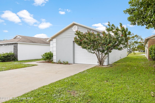 view of property exterior featuring a garage and a lawn