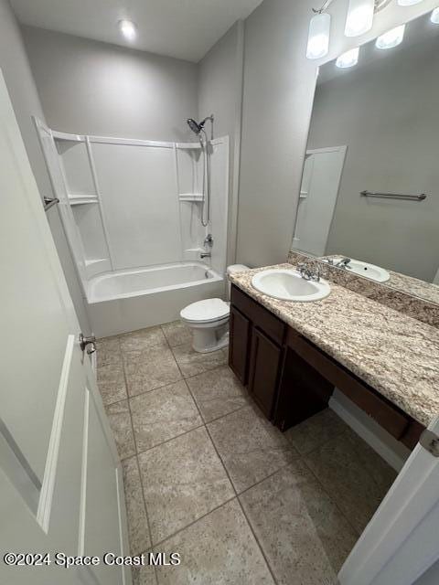 full bathroom featuring  shower combination, tile patterned floors, vanity, and toilet