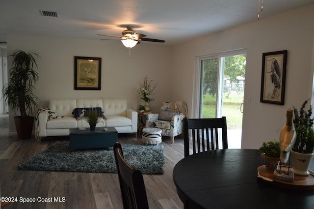 living room featuring hardwood / wood-style flooring and ceiling fan