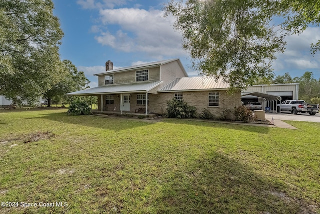 view of front of property featuring a garage and a front lawn