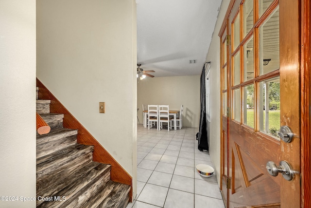 tiled foyer entrance featuring ceiling fan