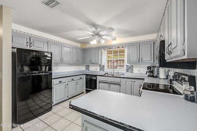 kitchen featuring sink, ceiling fan, gray cabinetry, and black appliances