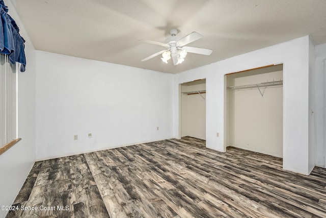 unfurnished bedroom with a closet, ceiling fan, dark hardwood / wood-style flooring, and a textured ceiling