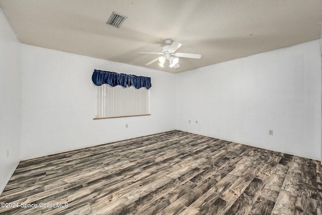 empty room with ceiling fan and wood-type flooring