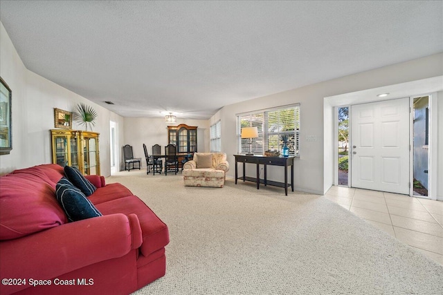 tiled living room with a textured ceiling