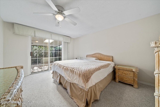 carpeted bedroom featuring access to exterior, ceiling fan, and a textured ceiling