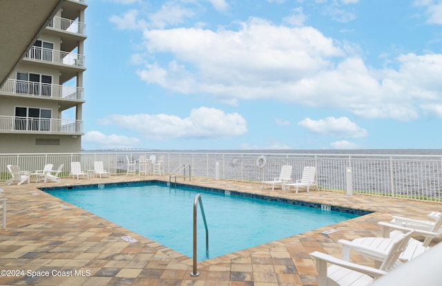 view of pool with a patio