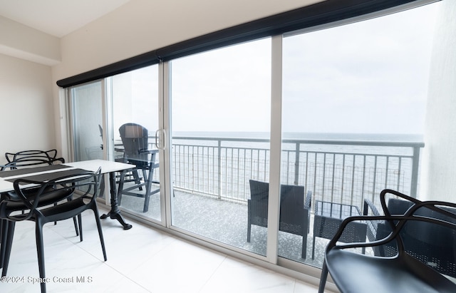 interior space featuring plenty of natural light and a water view